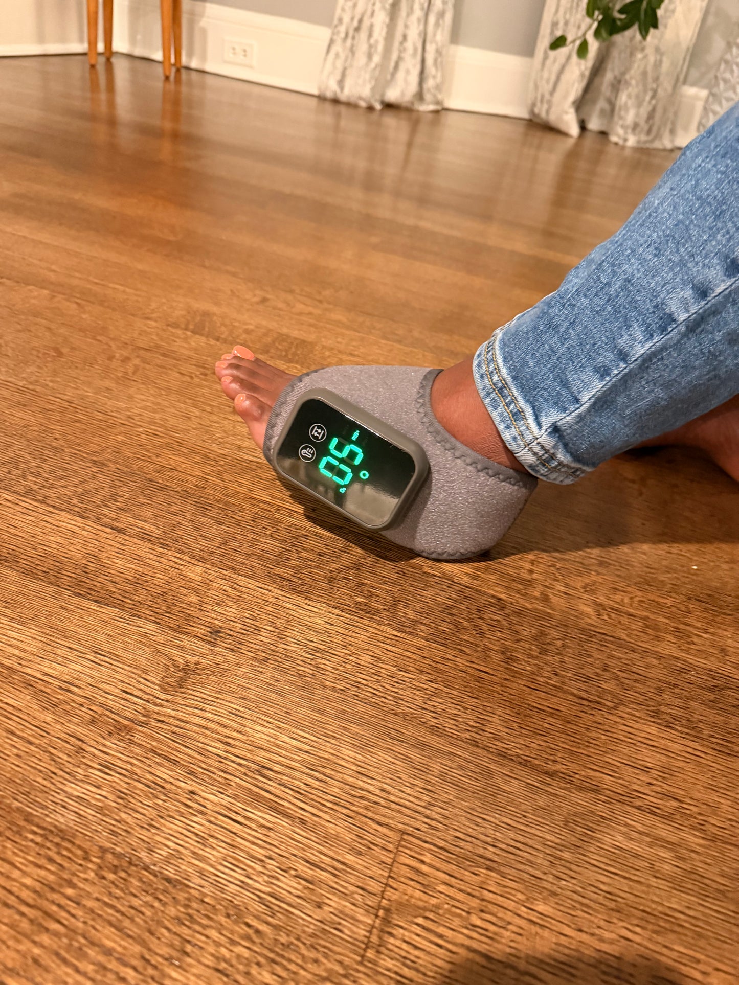 Orthisa foot and ankle massager on top of foot.